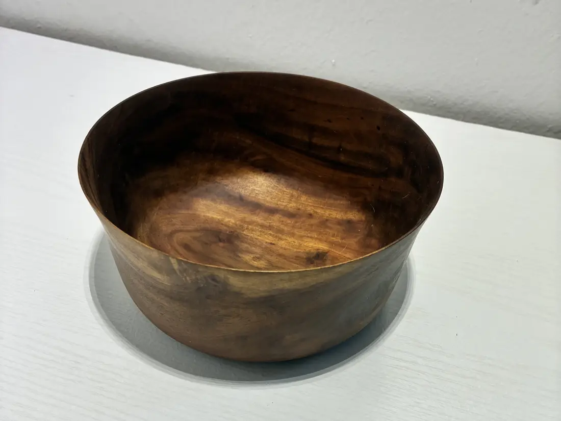 Kaleb’s flared bowl from above, oiled and finished, the grain swirling dark and gold