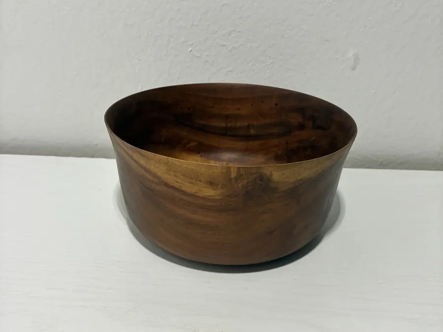 The flared bowl from the side, its walls thinning to the rim