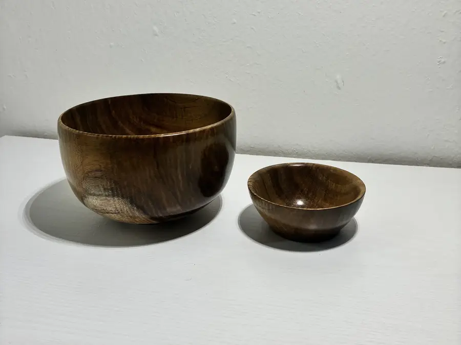 Kaleb’s curly koa pair, a large round bowl beside a small one